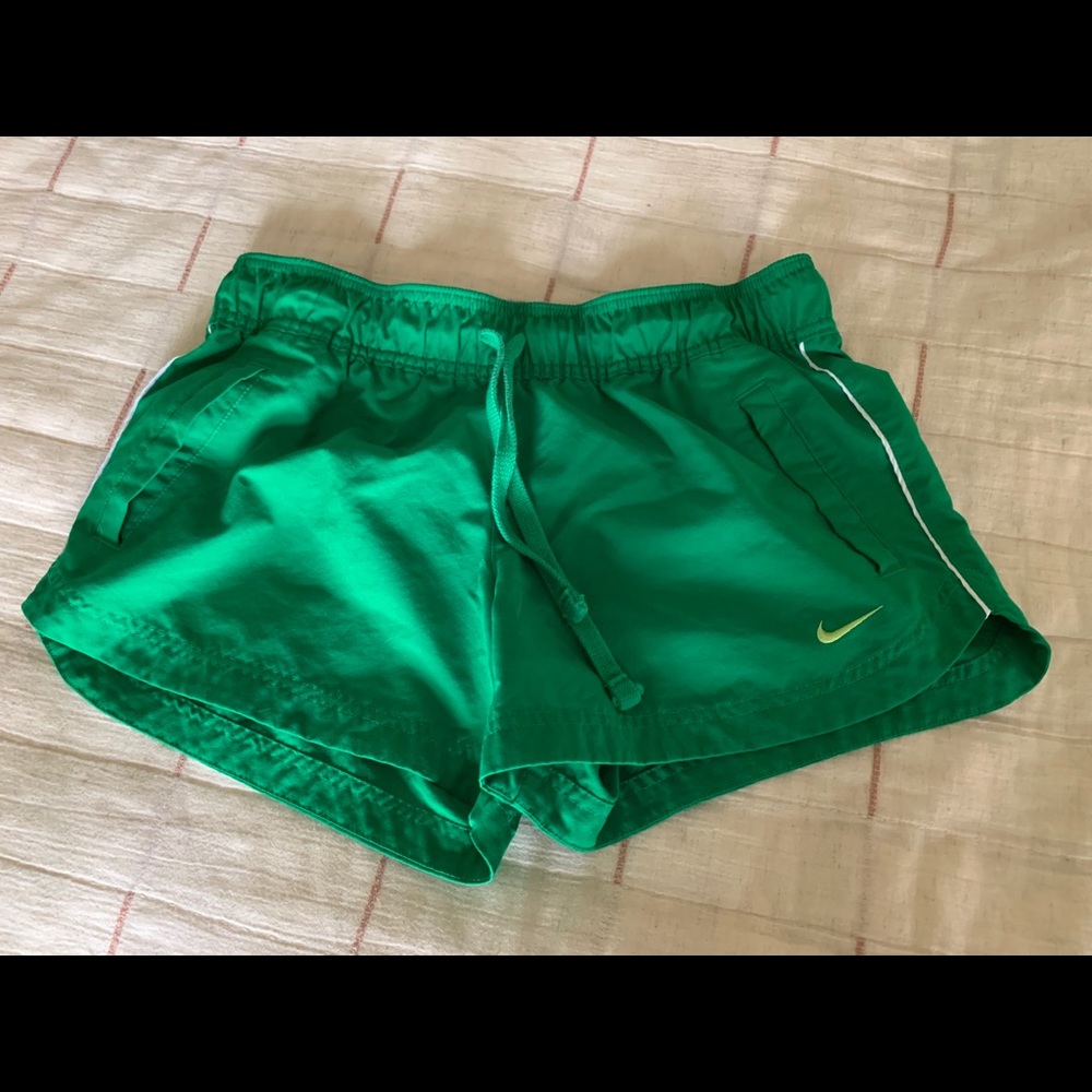 Green Nike running shorts